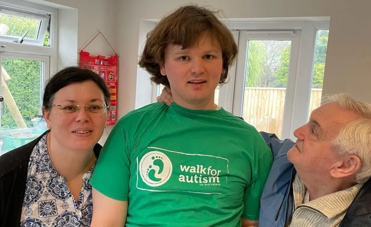 Me with mum and dad with my walk for autism t-shirt. l love walking